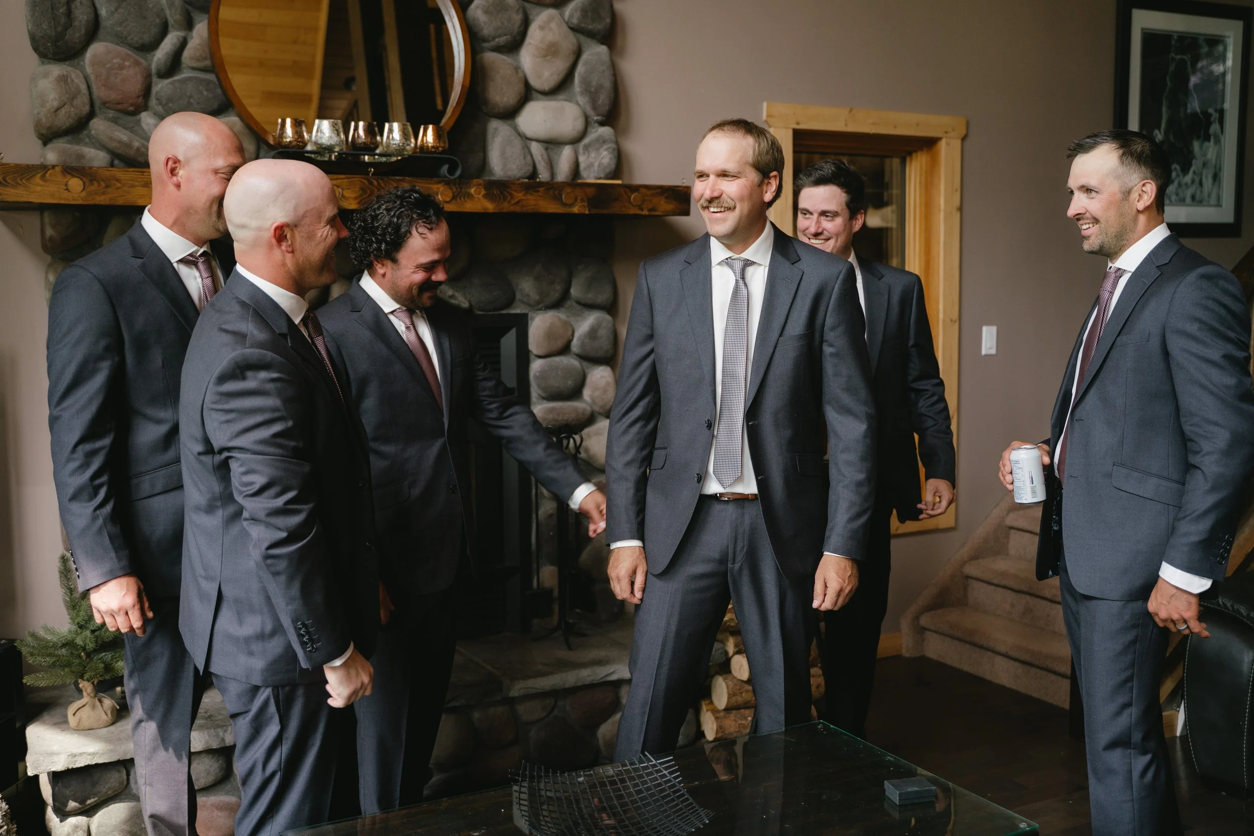 Group of six men dressed in gray suits