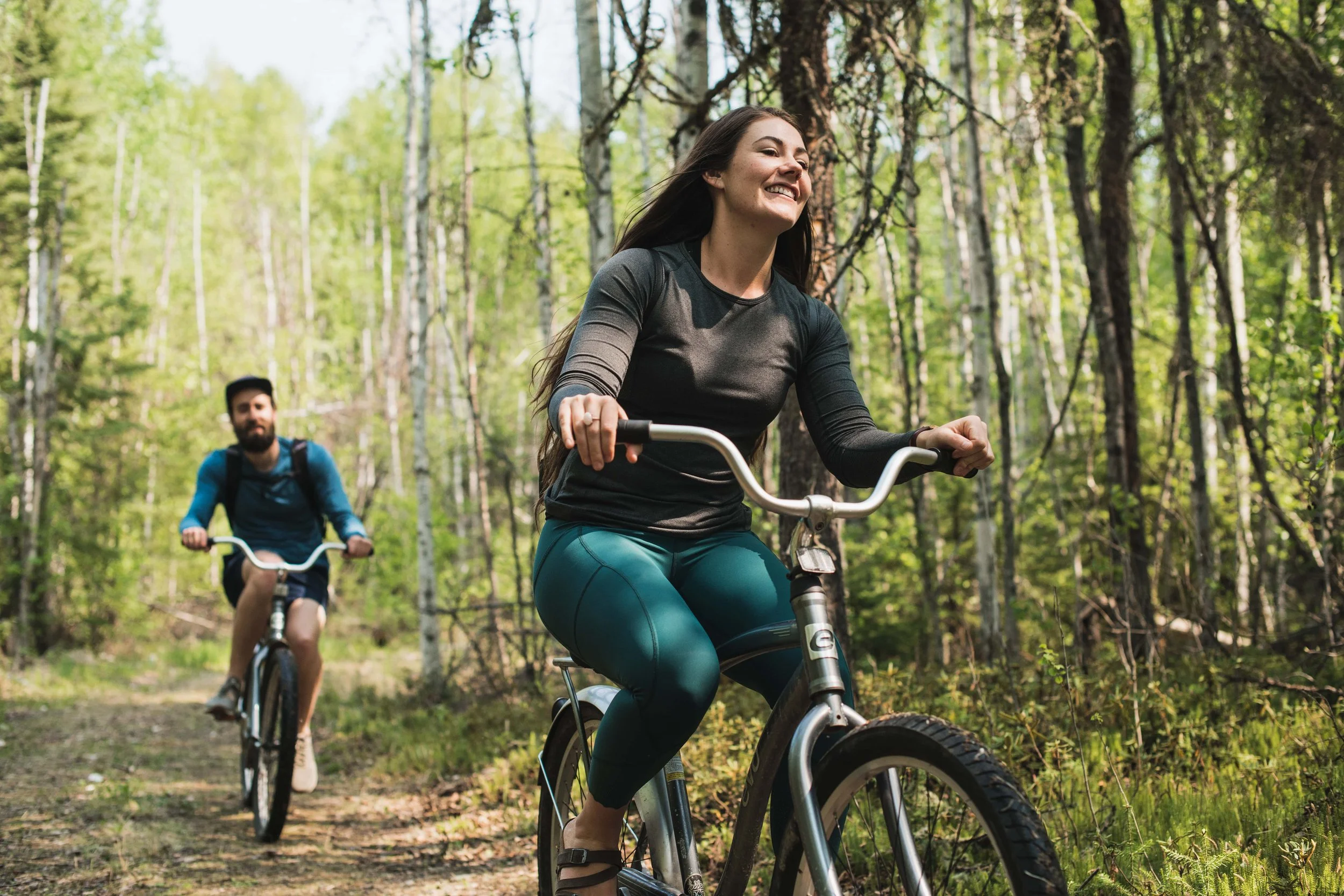 Cyclist riding a forest trail at Elk Ridge Resort