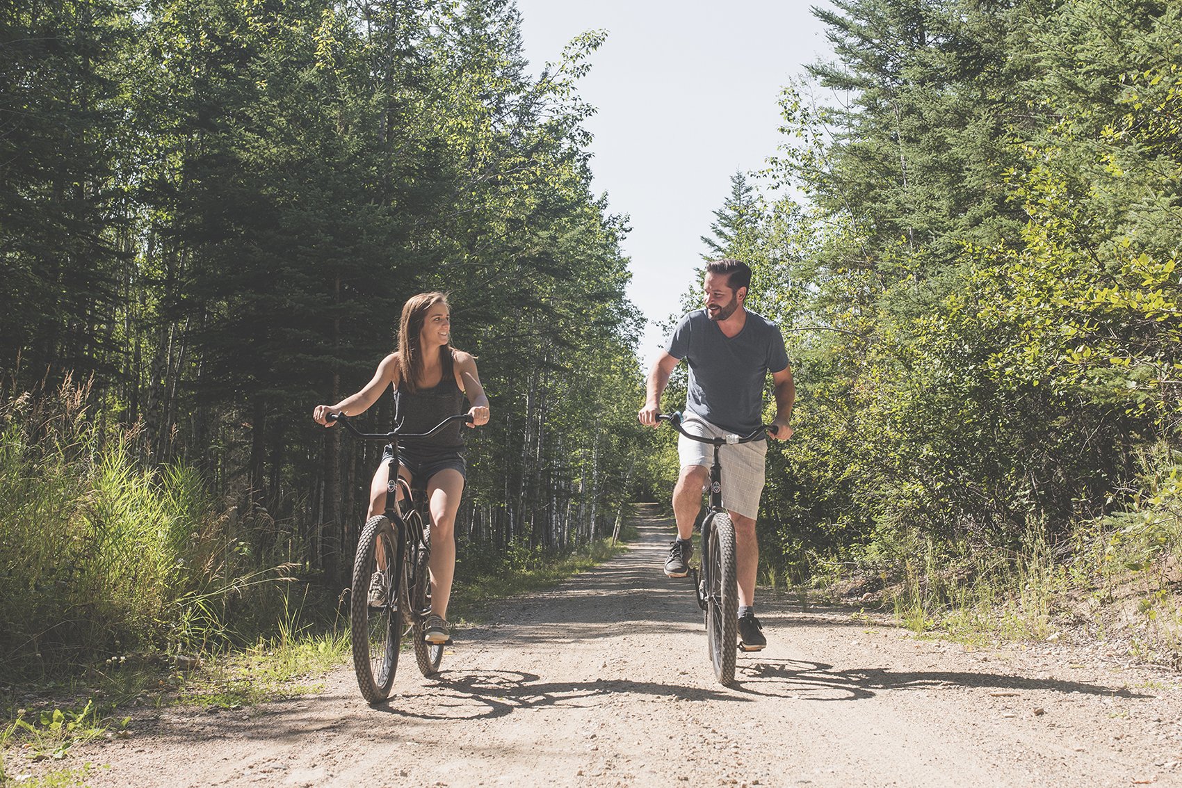 Bike trail winding through the boreal forest at Elk Ridge Resort