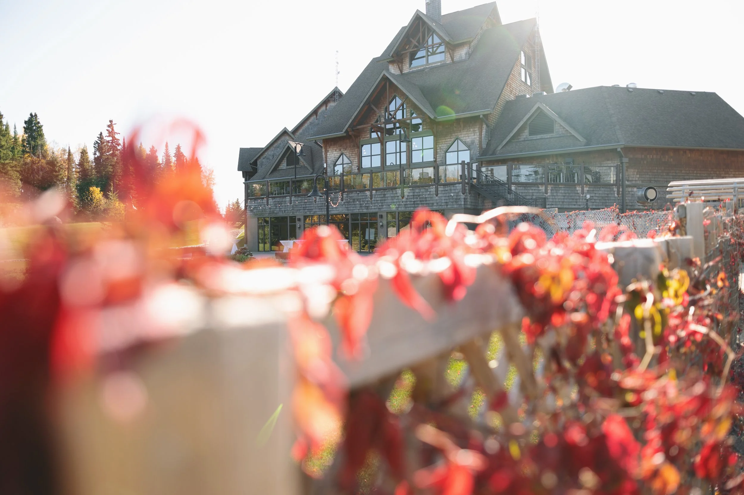The Lodge at Elk Ridge Resort framed by red autumn foliage