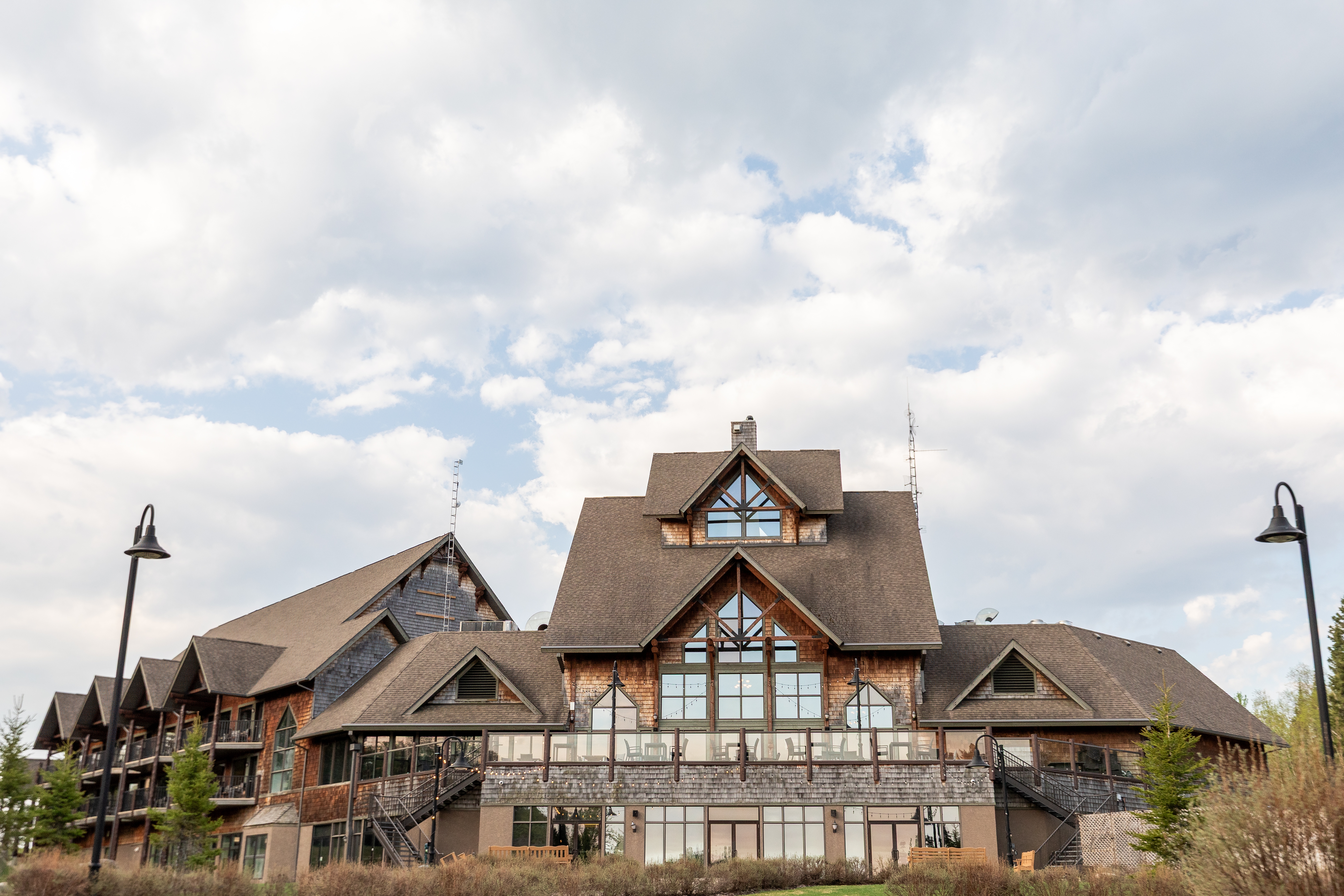 The Lodge at Elk Ridge Resort with tall gable windows and balconies under a cloudy sky