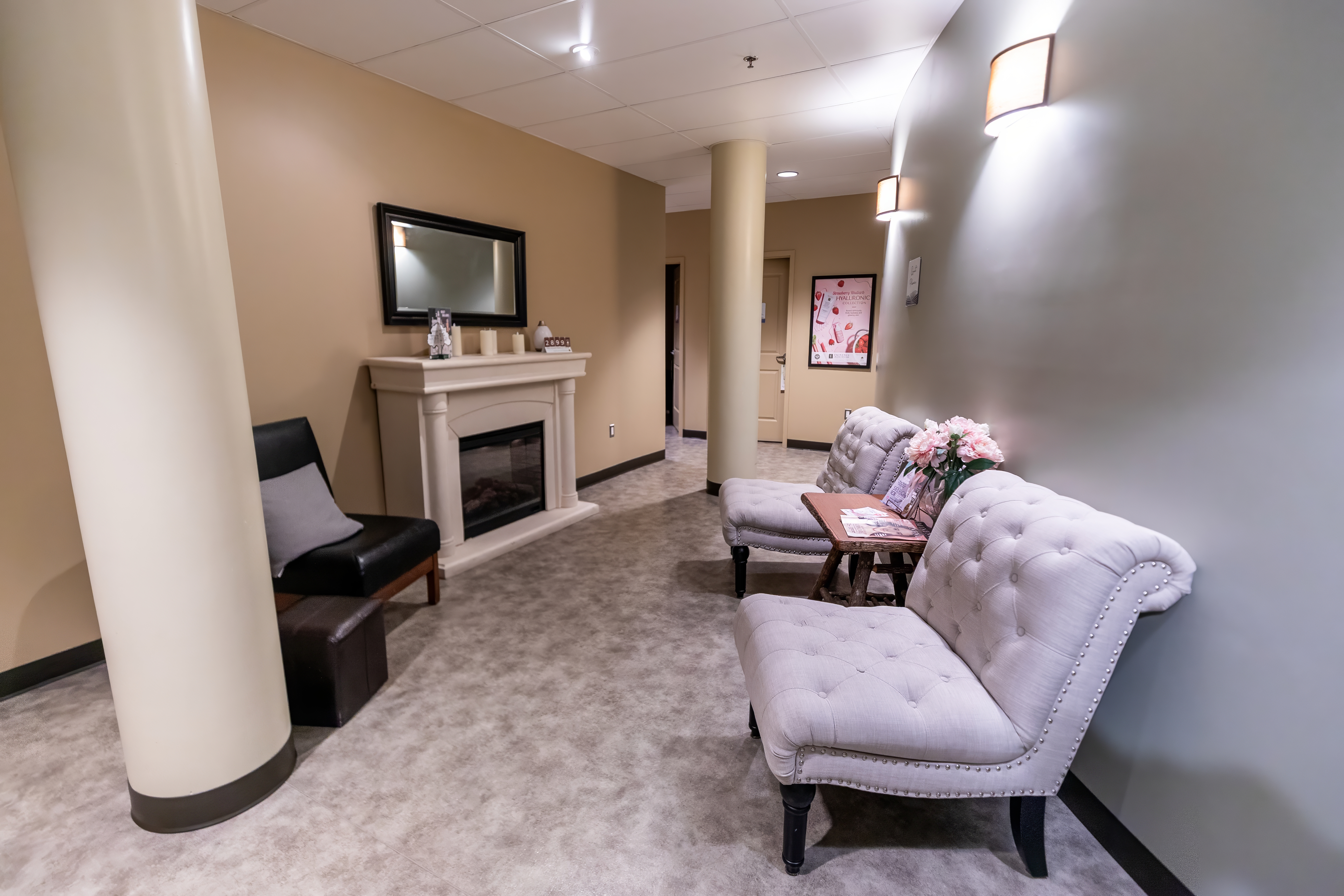Relaxation lounge at Drift Spa with tufted chaises and a fireplace