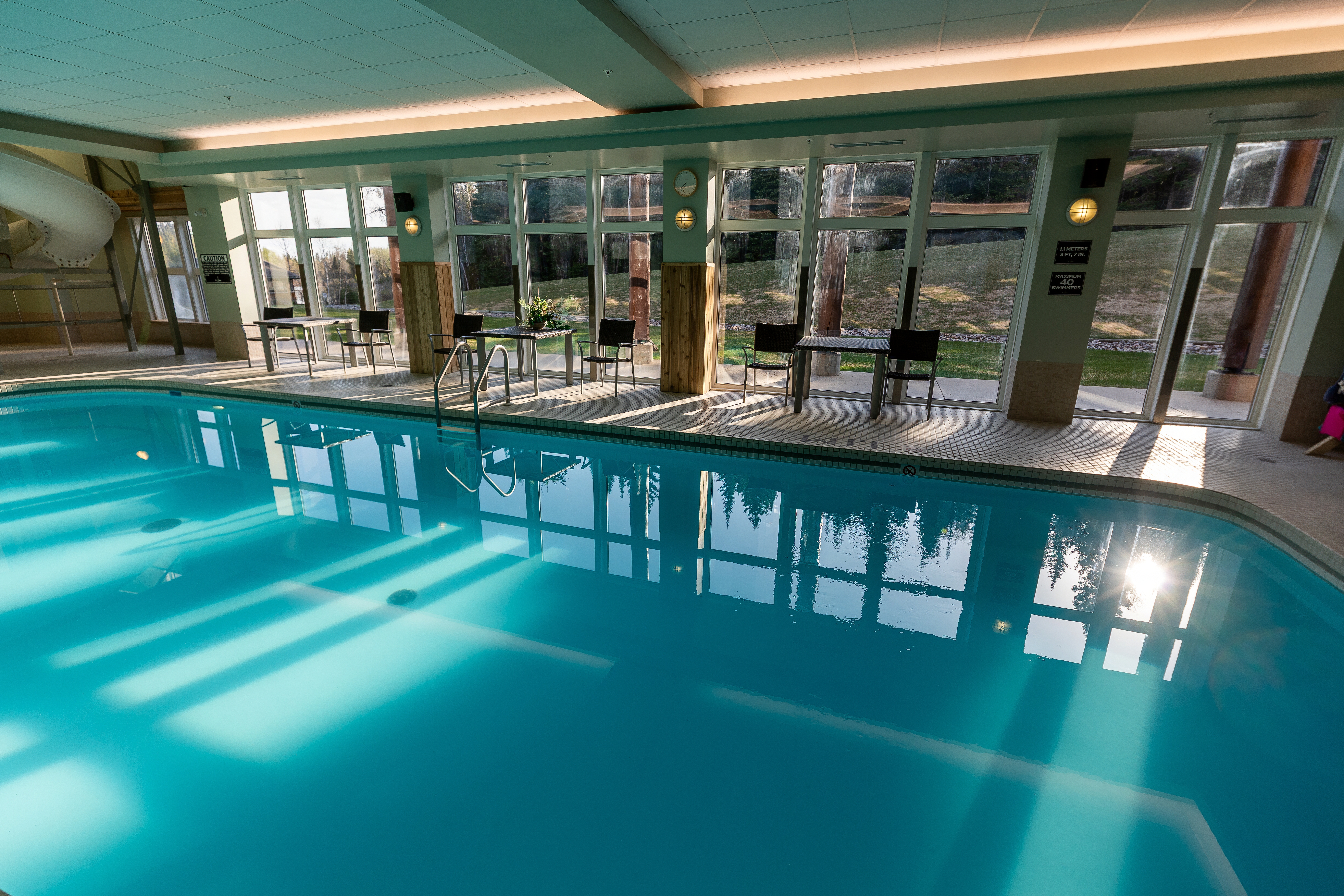 Sunlit indoor pool at Elk Ridge Resort with light patterns on the water